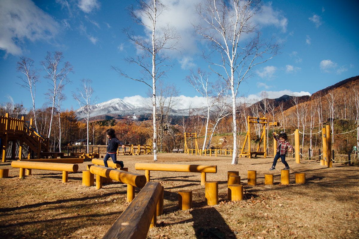 Fresh Snow on The Mountain and Kids Playing in the Park